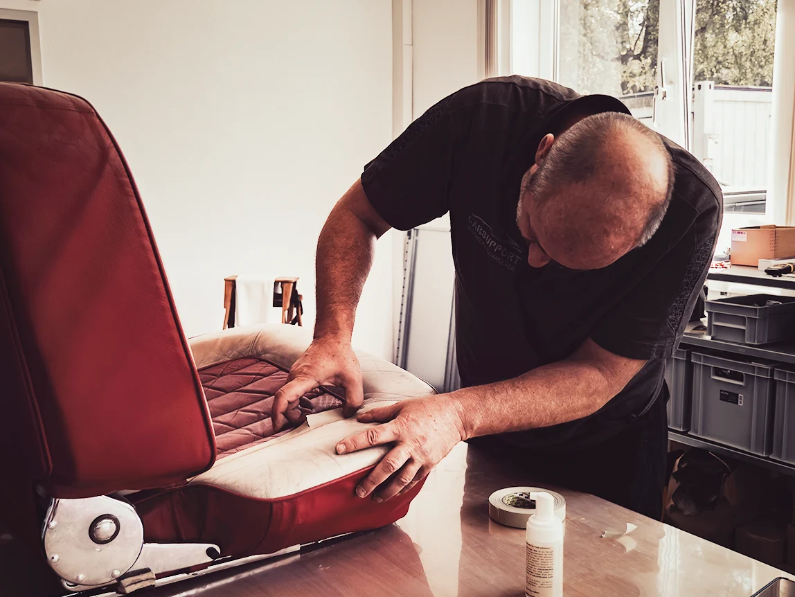Handwork on a classic leather seat in the leather workshop