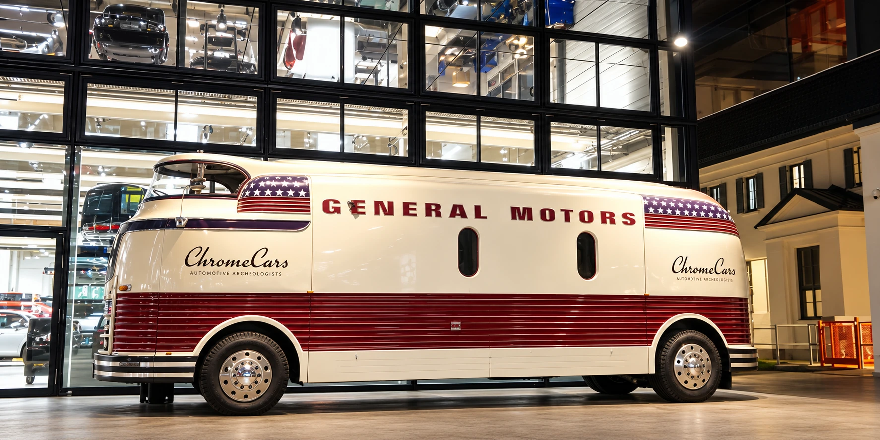 Historic cream and burgundy vehicle inside a hall